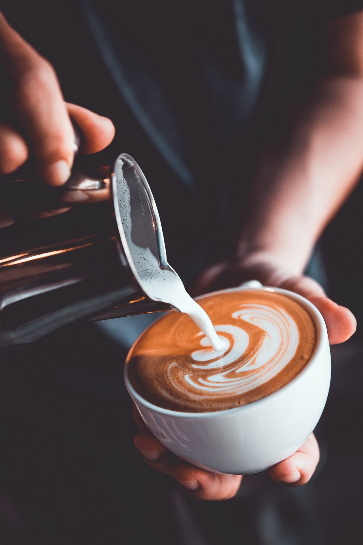 Barista pouring latte art