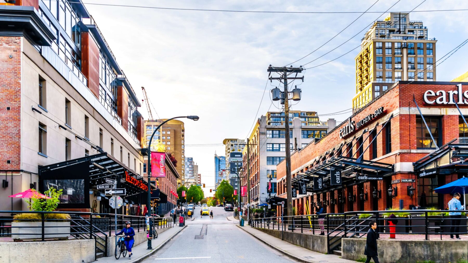 City street with shopping and restaurant.