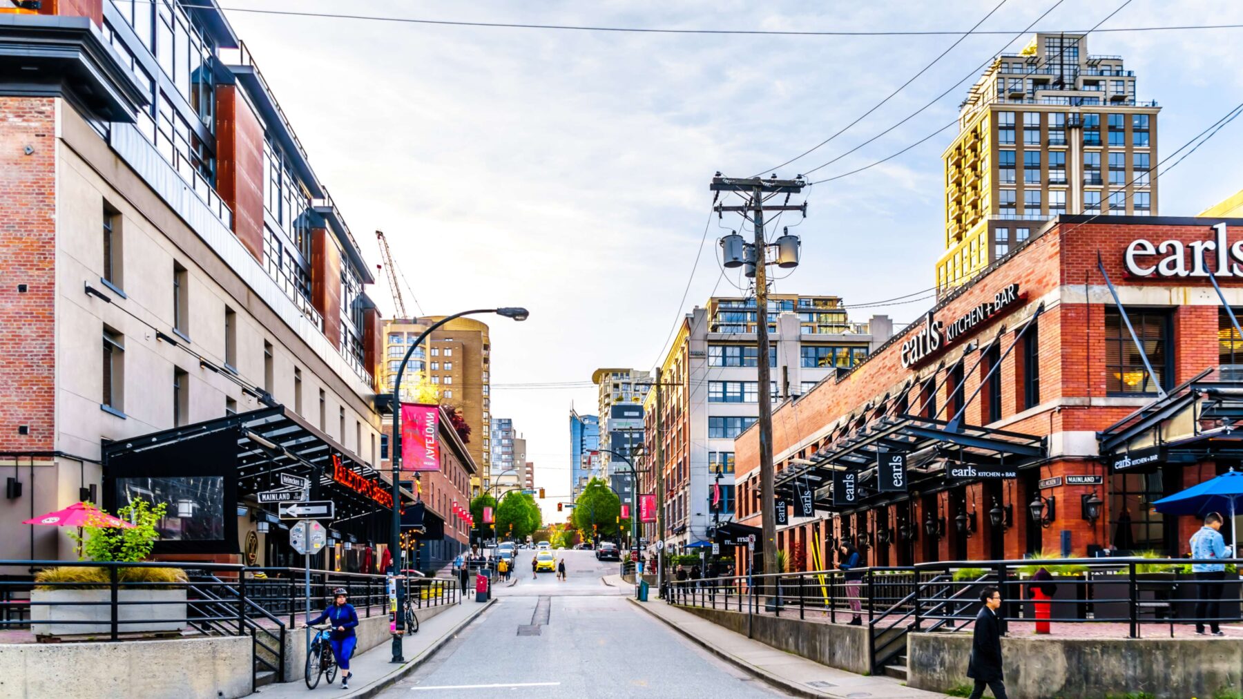 shot of downtown looking area with shops and food and drink places.