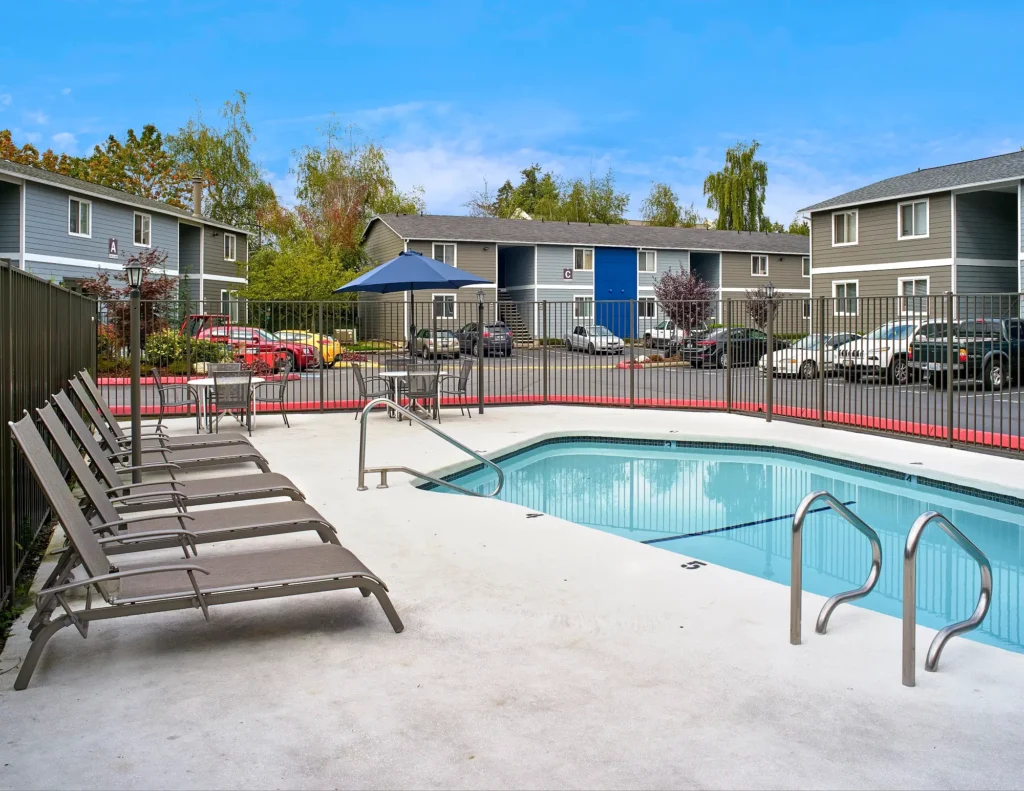 Irwin park outdoor pool with lounge poolside seating and tables.