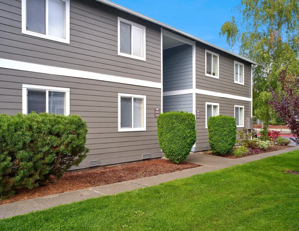 Irwin Park sidewalks and grass between community buildings.