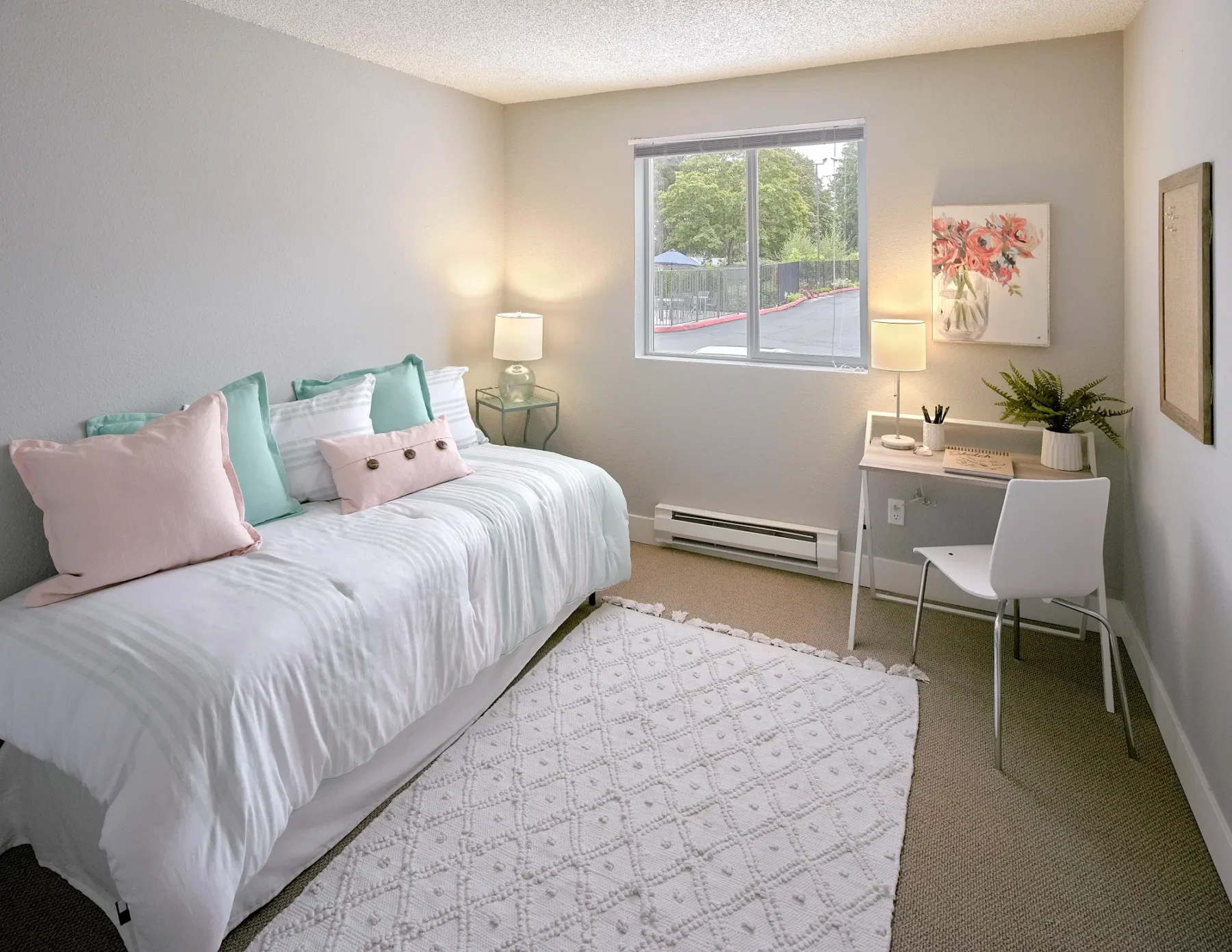 Bedroom with window and carpet.