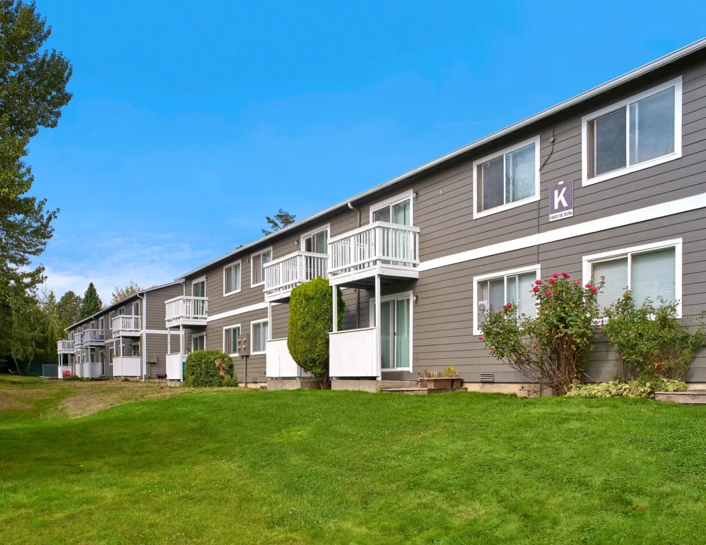 Irwin Park sidewalks and grass between community buildings.
