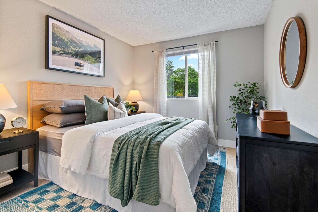 Bedroom with carpet and window